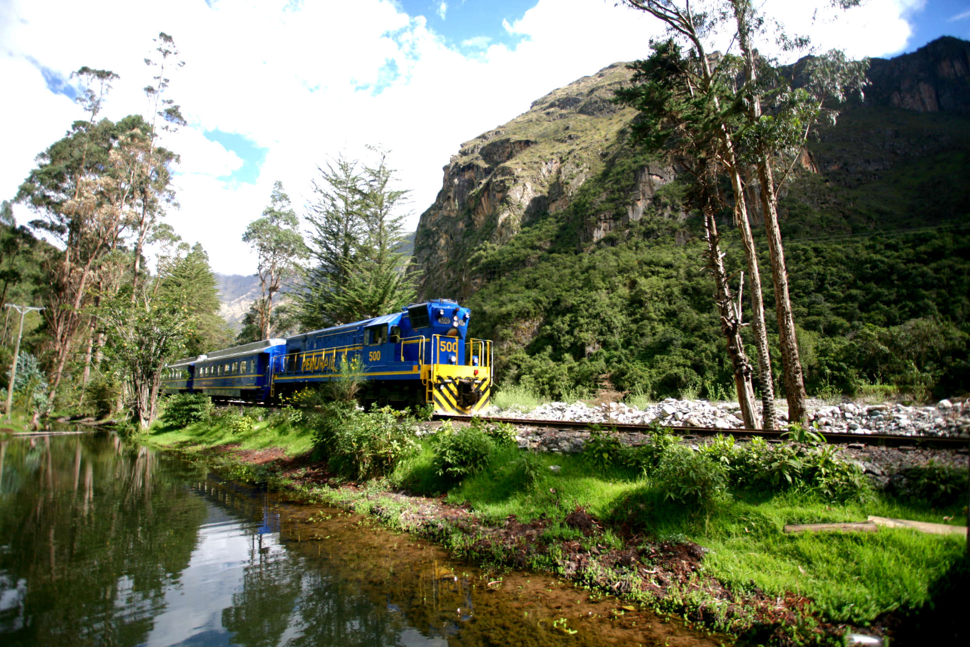 Tourist train crossing the Sacred Valley heading to Machu Picchu